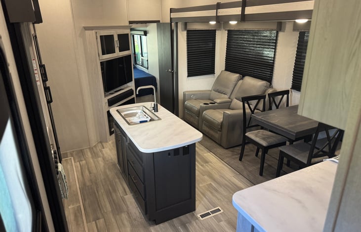 Living Room - View from Master Bed - There are some basic cleaning supplies under the sink