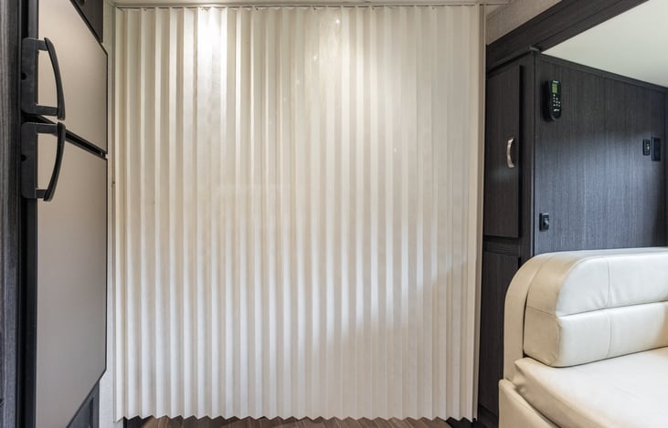 Privacy screen to separate bedroom and bathroom areas.