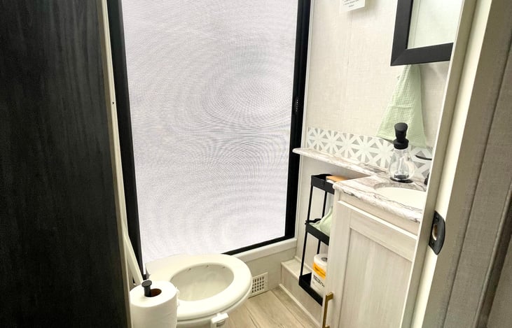 Shower curtain slides closed to the right. To open slighted unhinge to the right and slowly retract to the left.