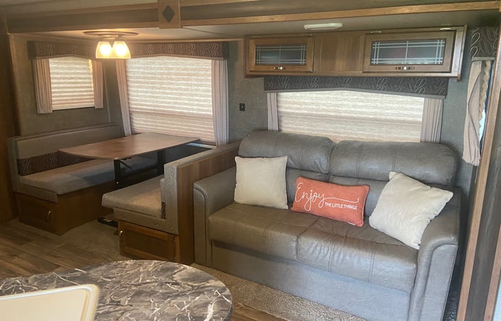 The table and couch both fold down into beds for additional guests!