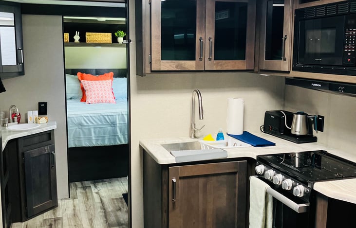 Kitchen/Bathroom/Bedroom with doors open.