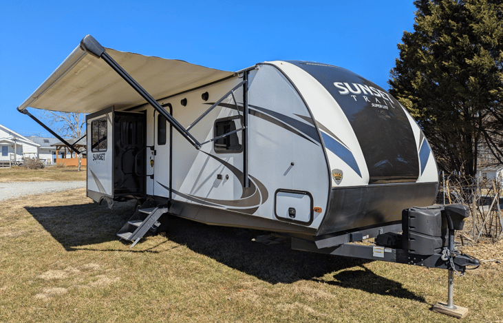 Luxury 30' triple-slide trailer with a gourmet rear kitchen & private master suite. Massive open-concept living and theater seating—the ultimate upscale home on wheels for your next getaway!