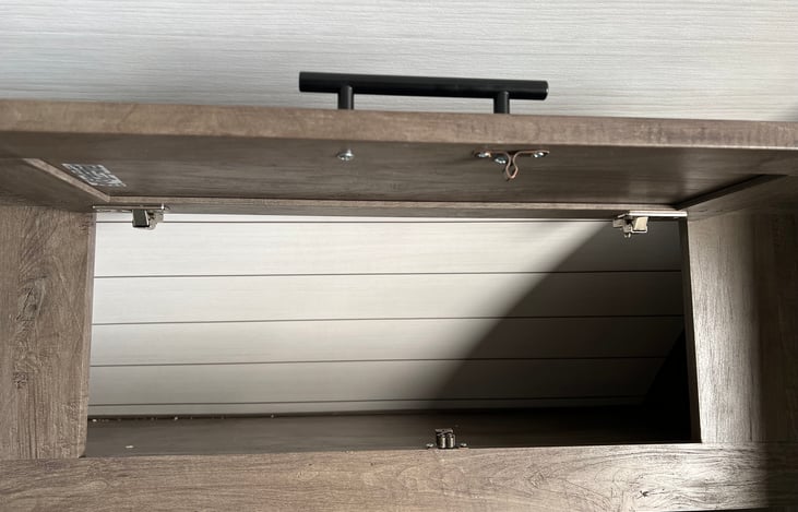 Upper cabinets - upper storage above sofa/bed area.