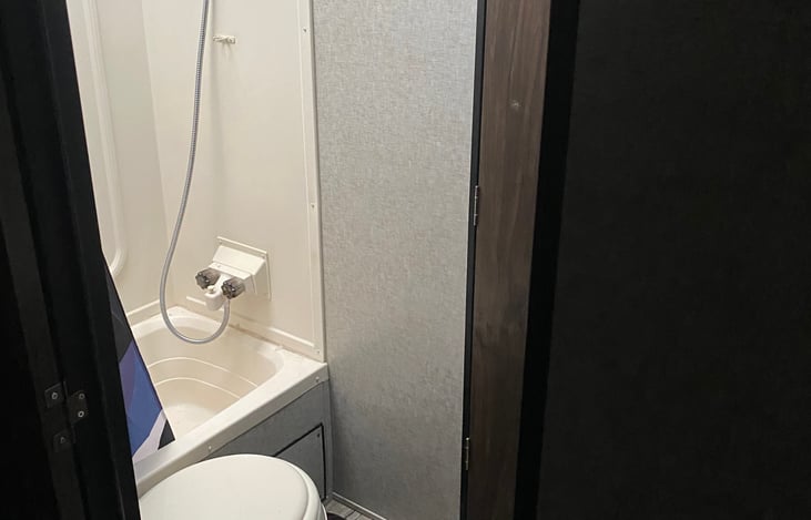 Toilet & Shower. Upgraded shower head for better water pressure