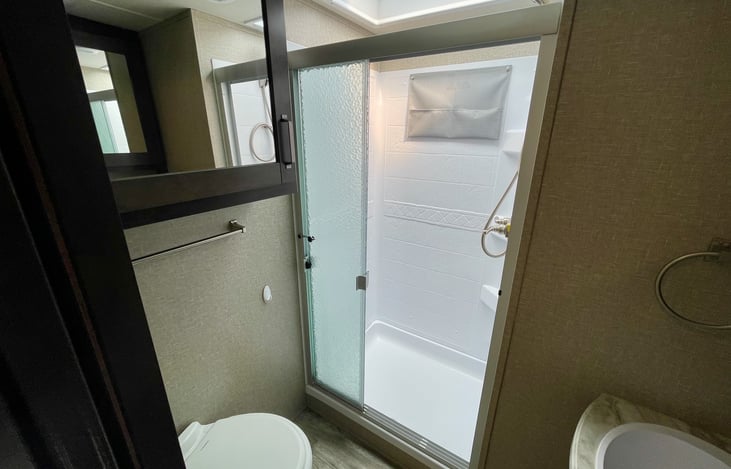 Full-sized shower. I am 6'2 and have plenty of room in the shower.