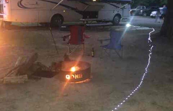 Chairs, outdoor lights, and starter firewood included