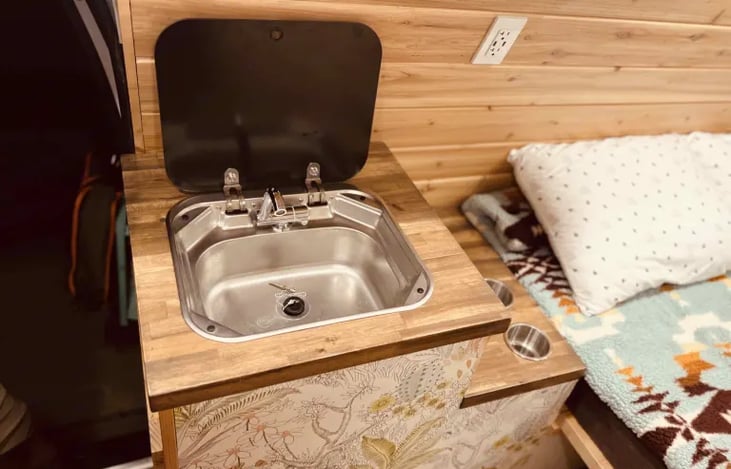 Sink 
Holds 5 gallons fresh water 
5 gallons grey tank