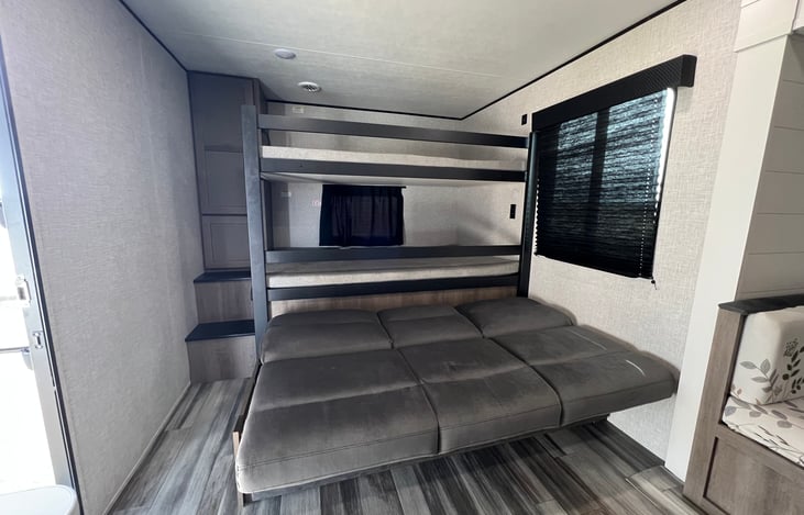 Full-over-full bunks + futon in main cabin area