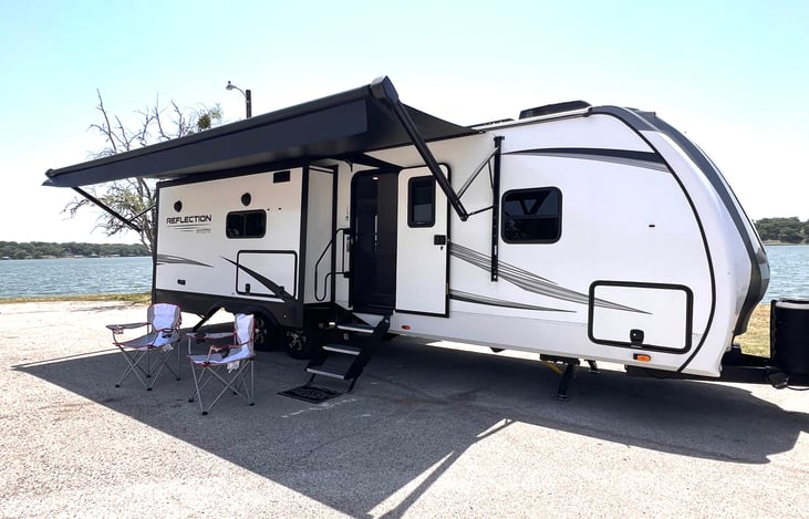 Welcome to our Grand Deaign Reflection camper! We love it and think you will too.  Large awning to give you plenty of shade as you relax outside.