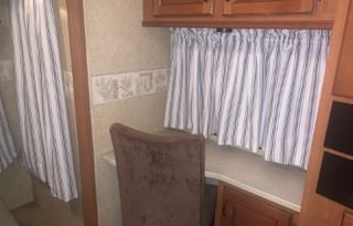 A 5th wheel travel trailer suited for 2 people