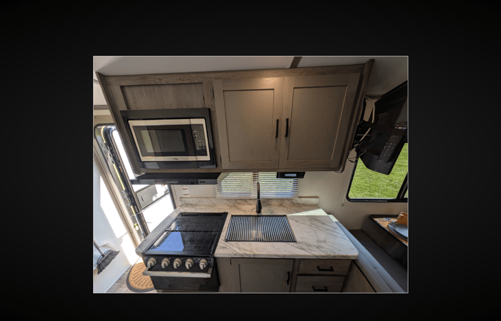 Fully Equipped Kitchen with Cookware and Dishes