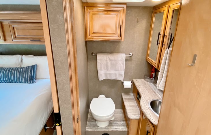 Small but functional bathroom. Sliding door separates bedroom from the bath hallway and bath door can stay open to close off living area for a larger bathroom and more privacy.