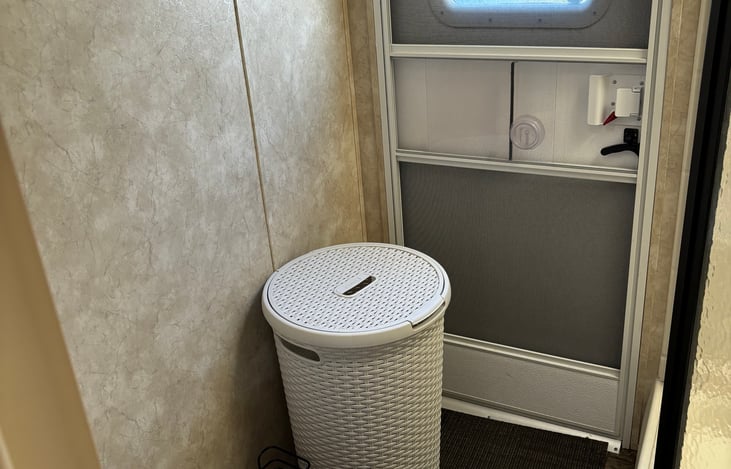 Door to outside from bathroom, nice on rainy days or when kids have played in sand or dirt/mud