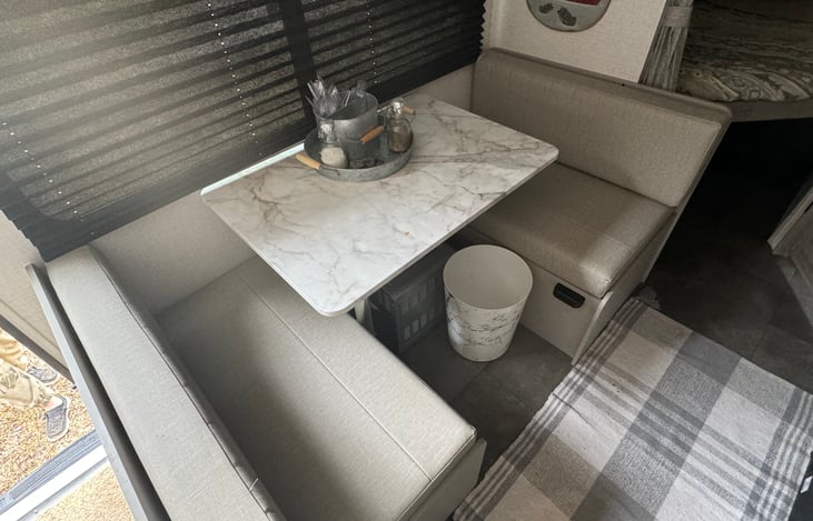 kitchen table that has storage under benches and can be made to a small sleeping area for smaller child.