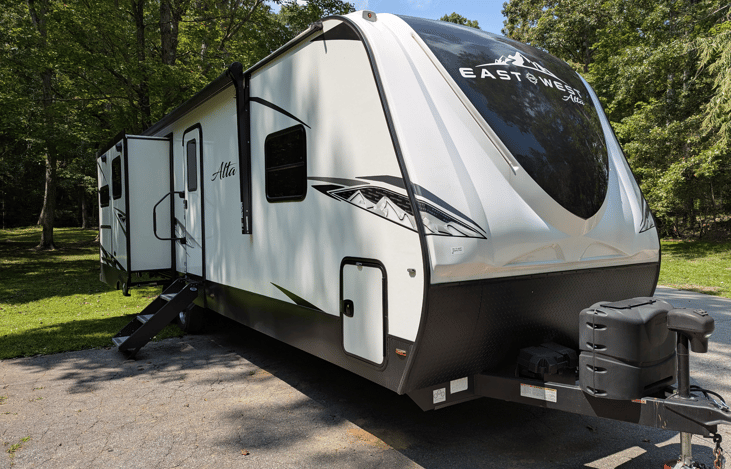 The East to West Alta is a spacious and luxurious camper. It features a bright and spacious interior, large kitchen island, 2 slide outs, king bed, outdoor kitchen, solar power and more.
