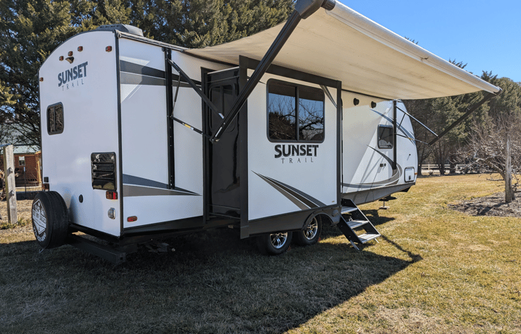 Luxury 30' triple-slide trailer with a gourmet rear kitchen & private master suite. Massive open-concept living and theater seating—the ultimate upscale home on wheels for your next getaway!