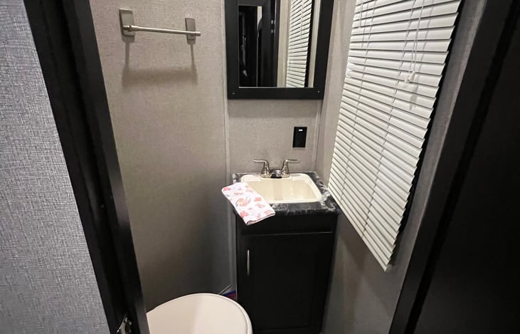 Garage 1/2 bath: toilet and sink