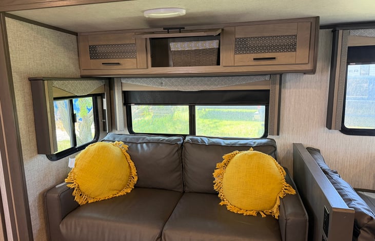 Couch with overhead storage.