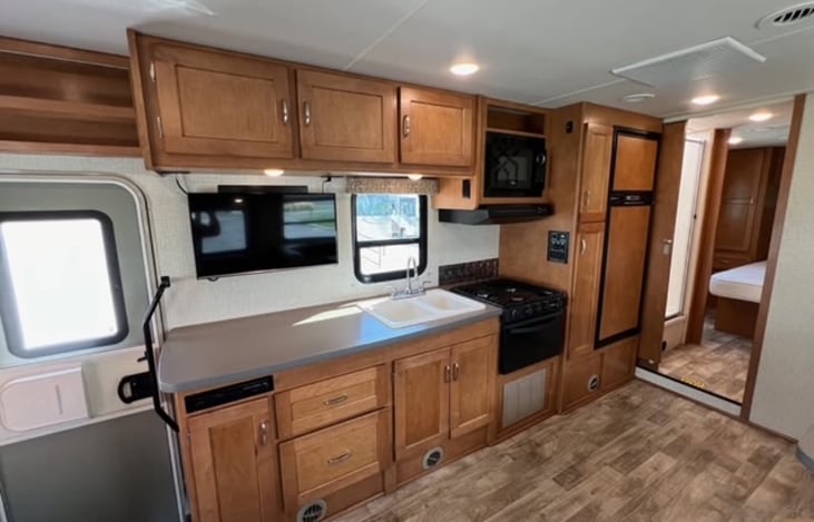 Large kitchen area with great space to prepare food. It also has a stove, oven, and microwave so it allows you to cook in anyway your family prefers!
