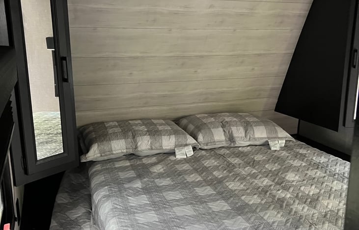 Bedroom with Queen Bed, Storage, Mirrors, 2 Windows and Option to turn 40" TV around to watch in bed.