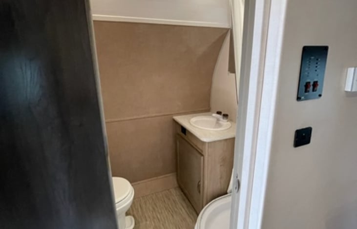 This bathroom is a private sanctuary that offers comfort and convenience. With a well-designed layout, quality fixtures, and ample storage, it provides a refreshing space for personal care.