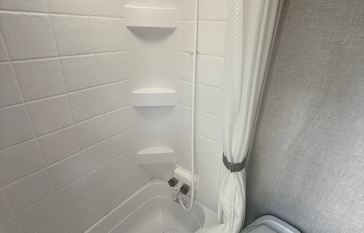 Shower and little bathtub.