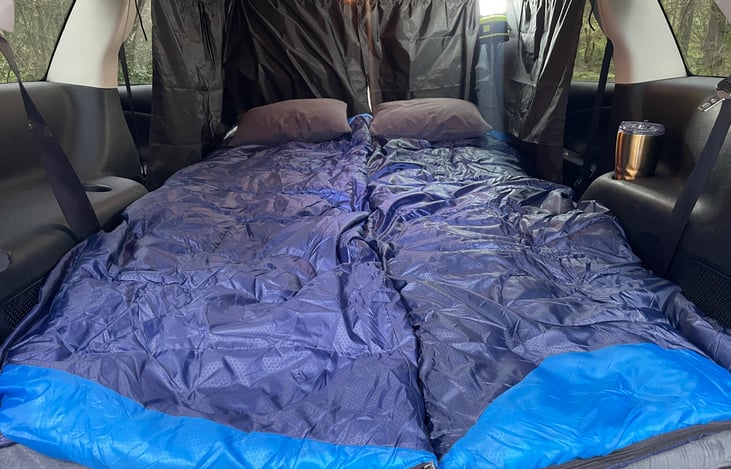 All the rear seats fold down for a flat surface. The 3" memory foam mattress measures 75" x 38" and offers firm support and no worries about waking up in the middle of the night.