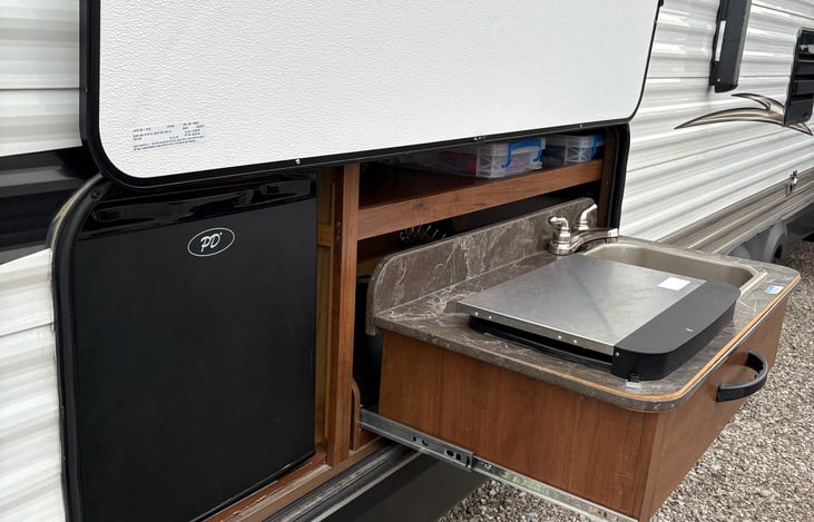 Outdoor kitchen (sink, 2-burner stove, and mini fridge)