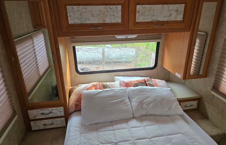 I find the bed to be surprisingly comfortable.  Towels and blankets stored above in the cabinets, extra blankets under the bed (It tilts up from the bottom), TV/DVD and closet space for your clothes.