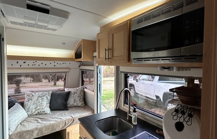 Looking toward the front with the dining area converted to bed/sofa