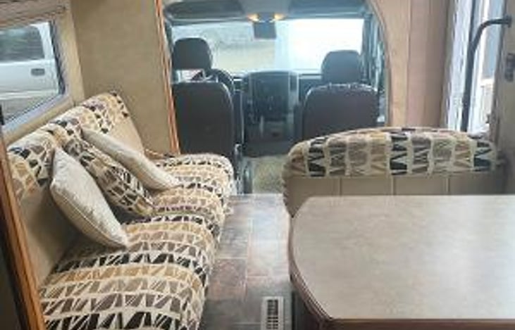 Inside View from the Rear.  Couch unfolds easily to a queen size bed.  Dinette table drops down to create s smaller bed for two kids or one adult.