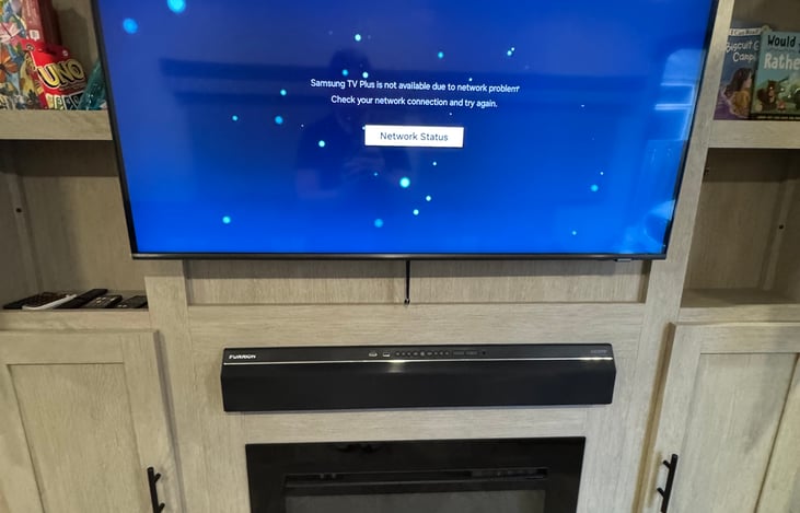 Entertainment center with fireplace and family activities.