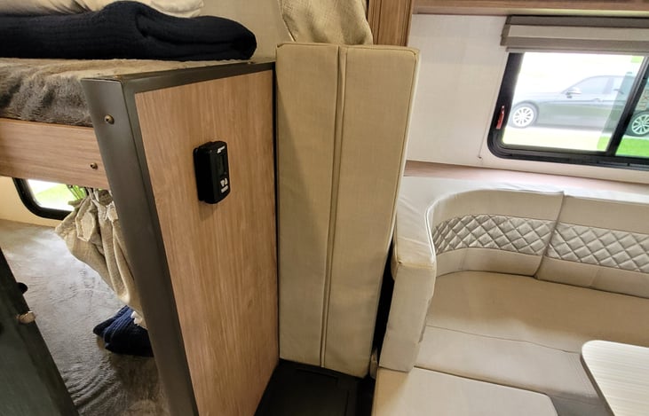 Thermostat, trash can, and dinette cushion placement.