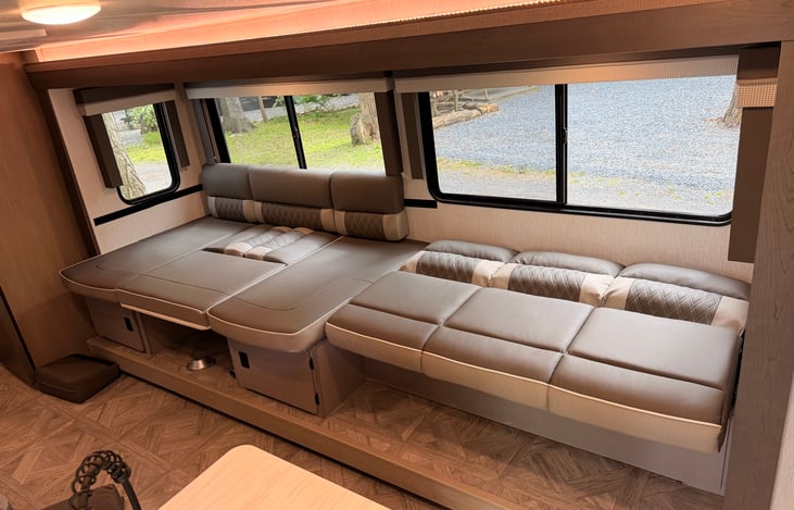 Versa lounge in the complete bed position. Couch pulls out and u shaped dinette turns into another bed as well