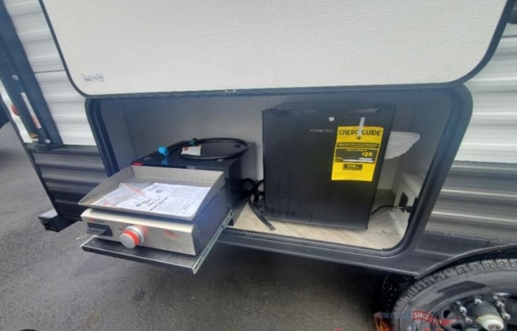 Outdoor kitchen.  Skillet and Fridge.