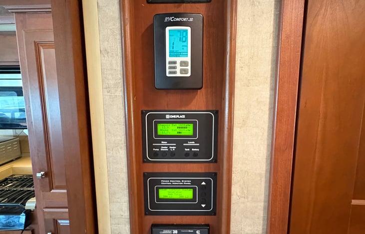 the main control panel for slideouts, air conditioning and heat, electrical system status, generator on/off, DC to AC inverter on/off