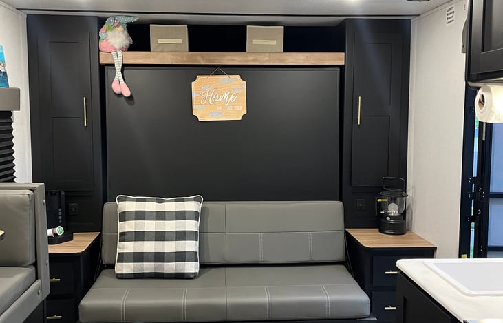 Couch and Murphy bed stored