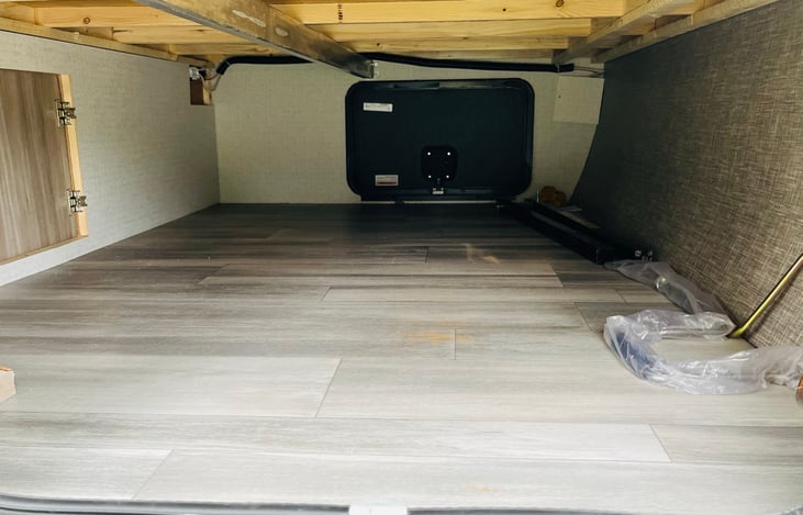 Pass-thru storage underneath main bed. Also accessible from the inside.