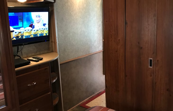 Rear bedroom with bathroom door closed.