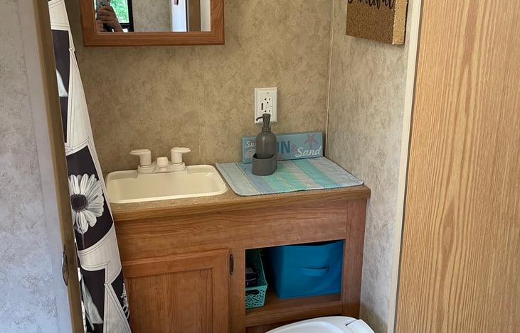 Bathroom with toilet, sink, and tub bath!