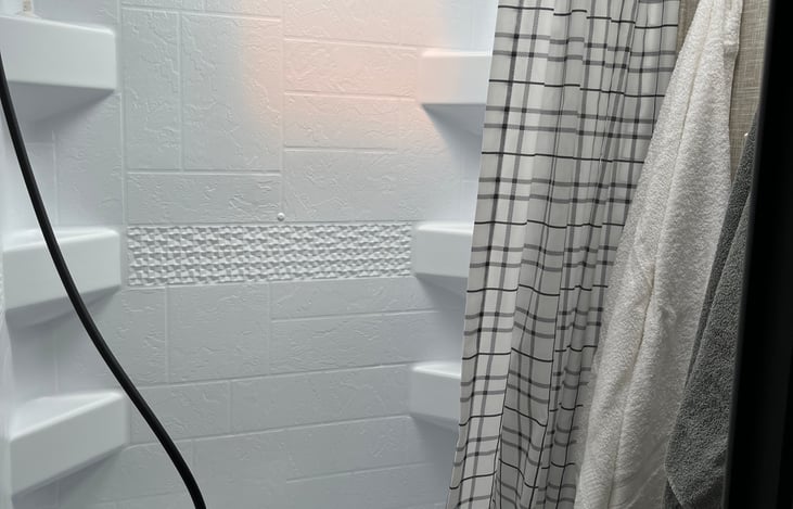 Shower and shallow tub, 5 bath towels and washcloths provided.