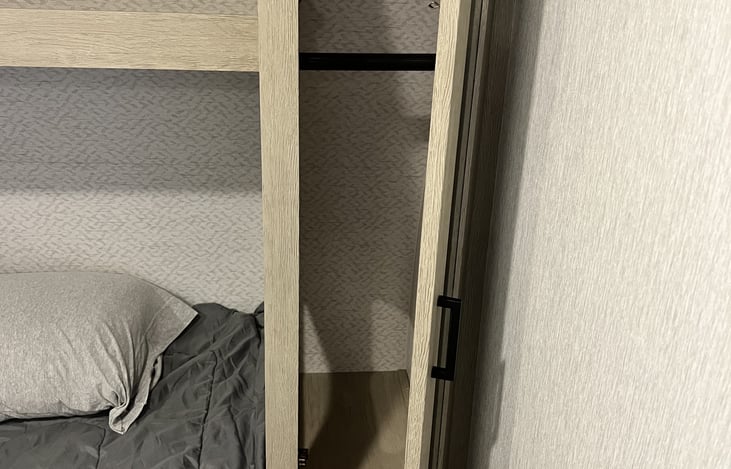 Storage closet on each side of bed in front bedroom.