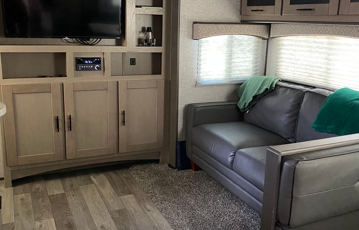 The living room. The smart TV can easily connect to your hotspot or the parks wifi. The couch folds out to sleep 2 adults.