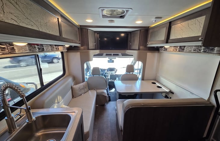 Lots of seating space, and the table goes down, and the couch comes in, and you have a full bed for two.