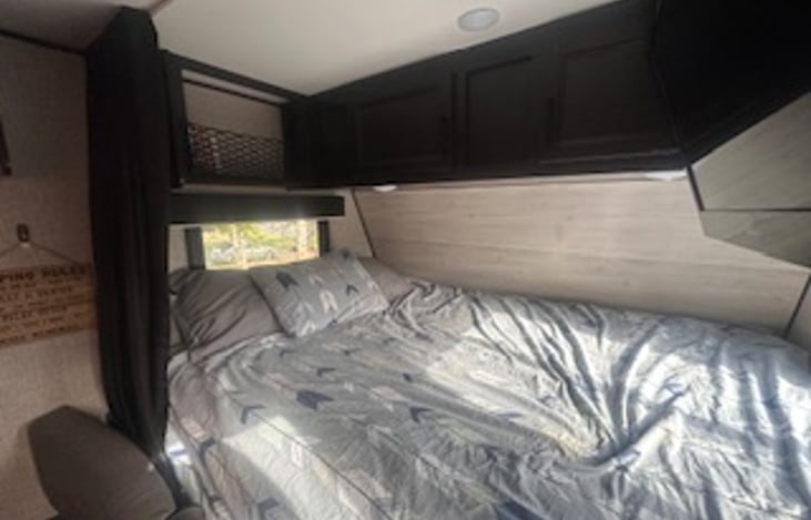 Queen Bed with a collection of books over head!