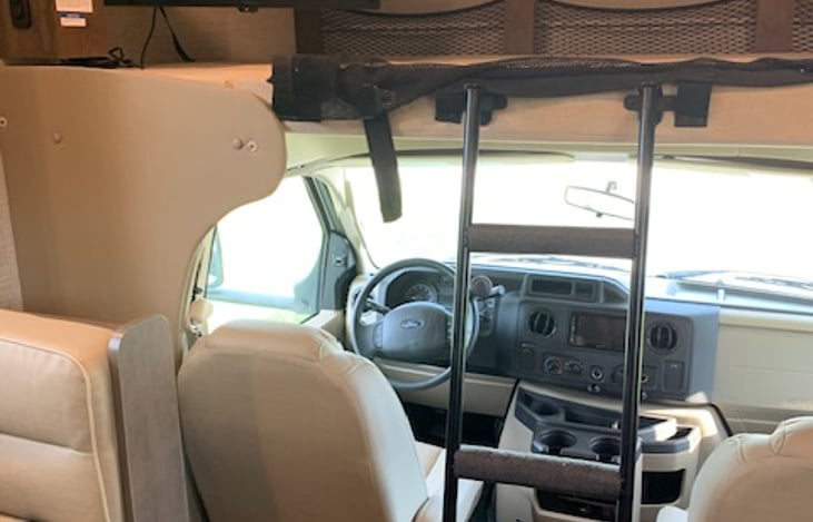 Overhead bunk with ladder; ladder can be removed. Steps are padded.