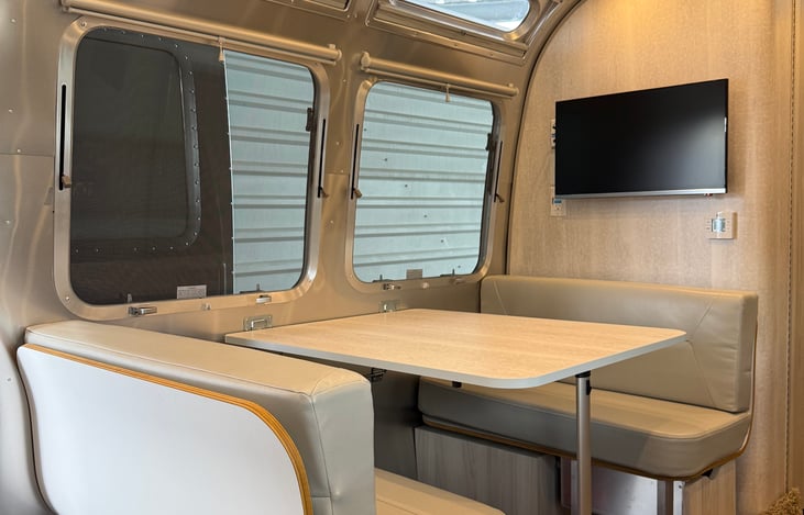 Dinette seating for up to 4 people with TV for common area