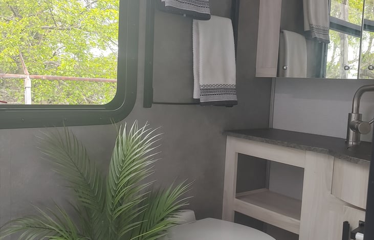 Shade pulls down for privacy.