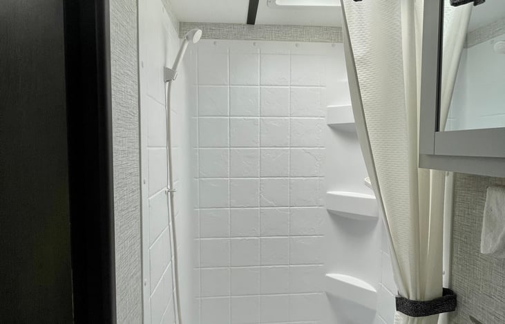 Shower, full tub surround with built-in shelves