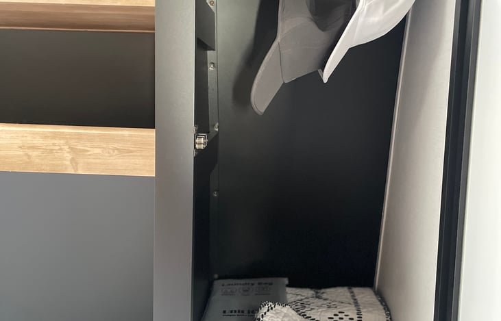 Hanging/storage locations on both sides of the bed.